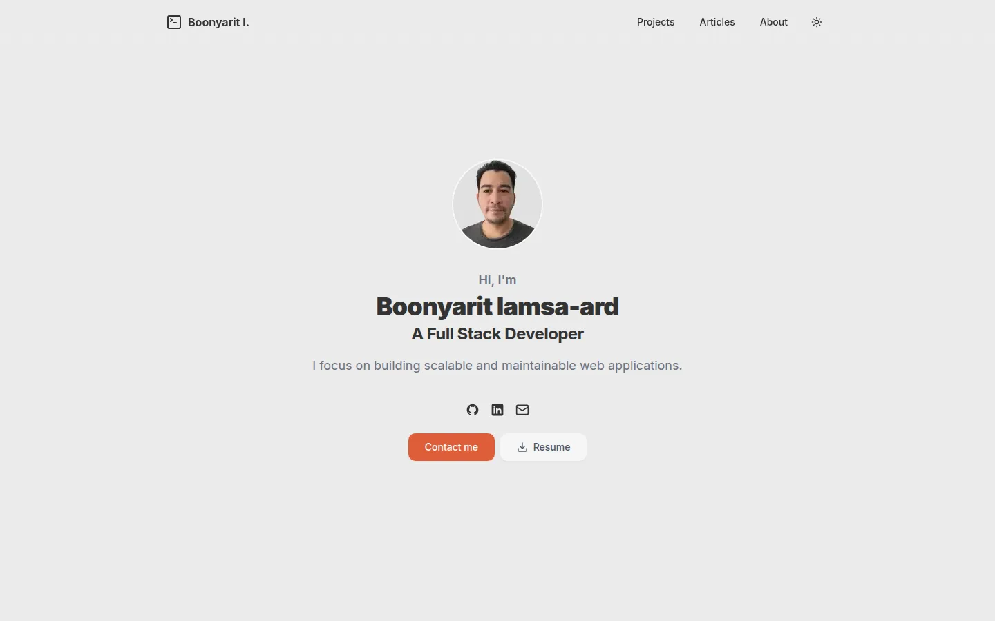 The old home page: a round photo, my name and a job title, centred on an empty page